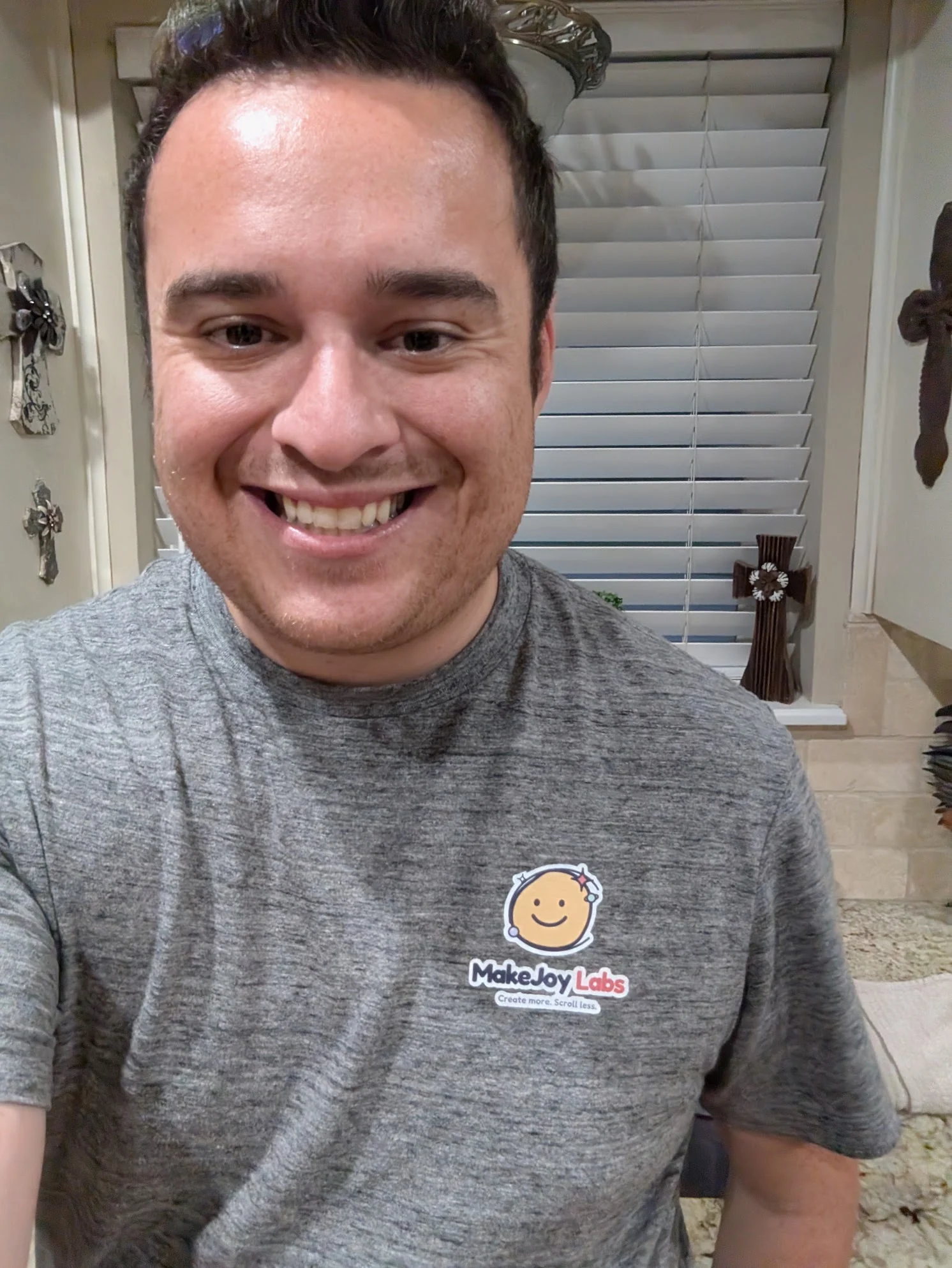 Matthew wearing a handmade gray MakeJoy Labs shirt